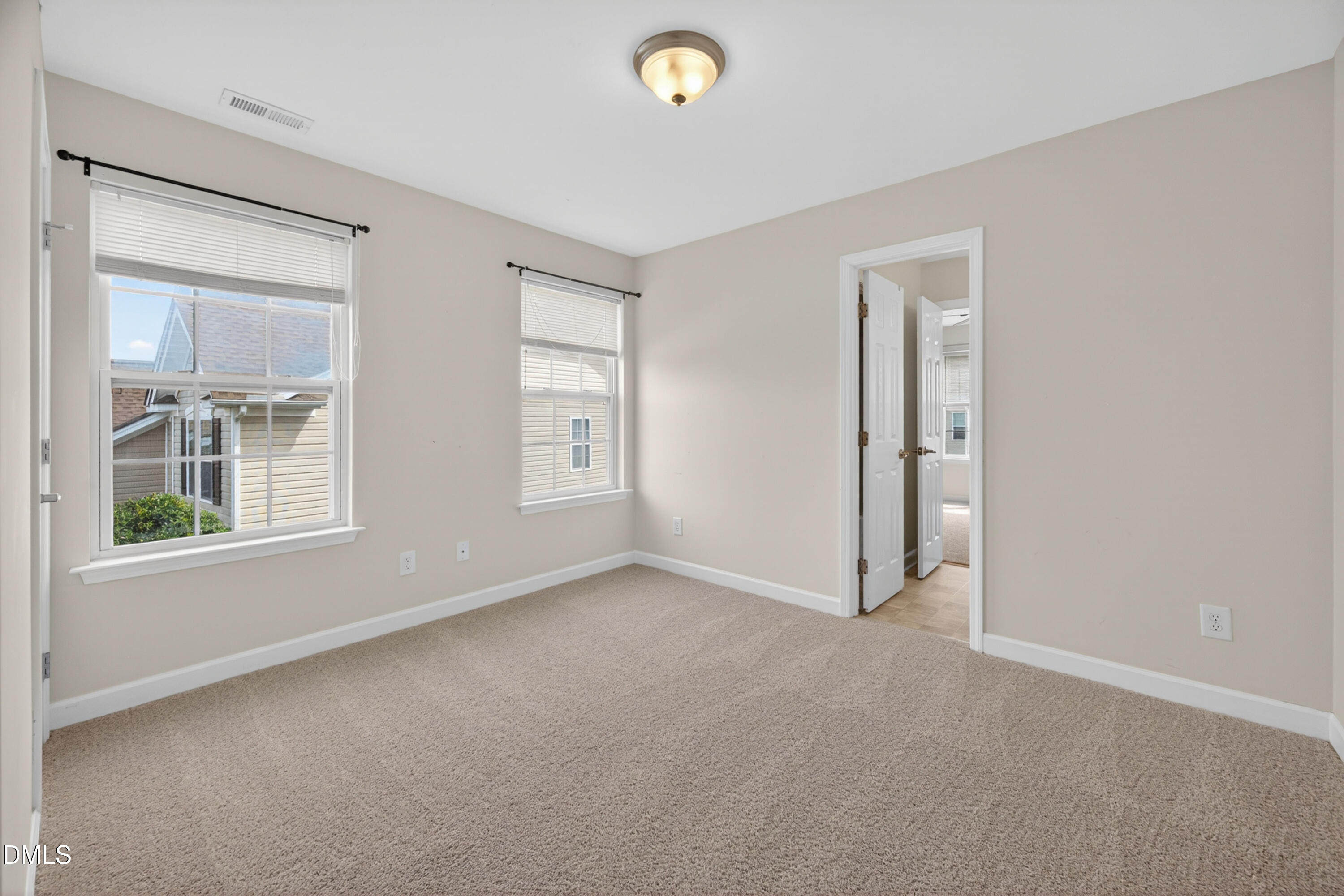 5304 Stone Station Drive Raleigh, NC 27616 - Photo 21 of 34 a view of an empty room with a window