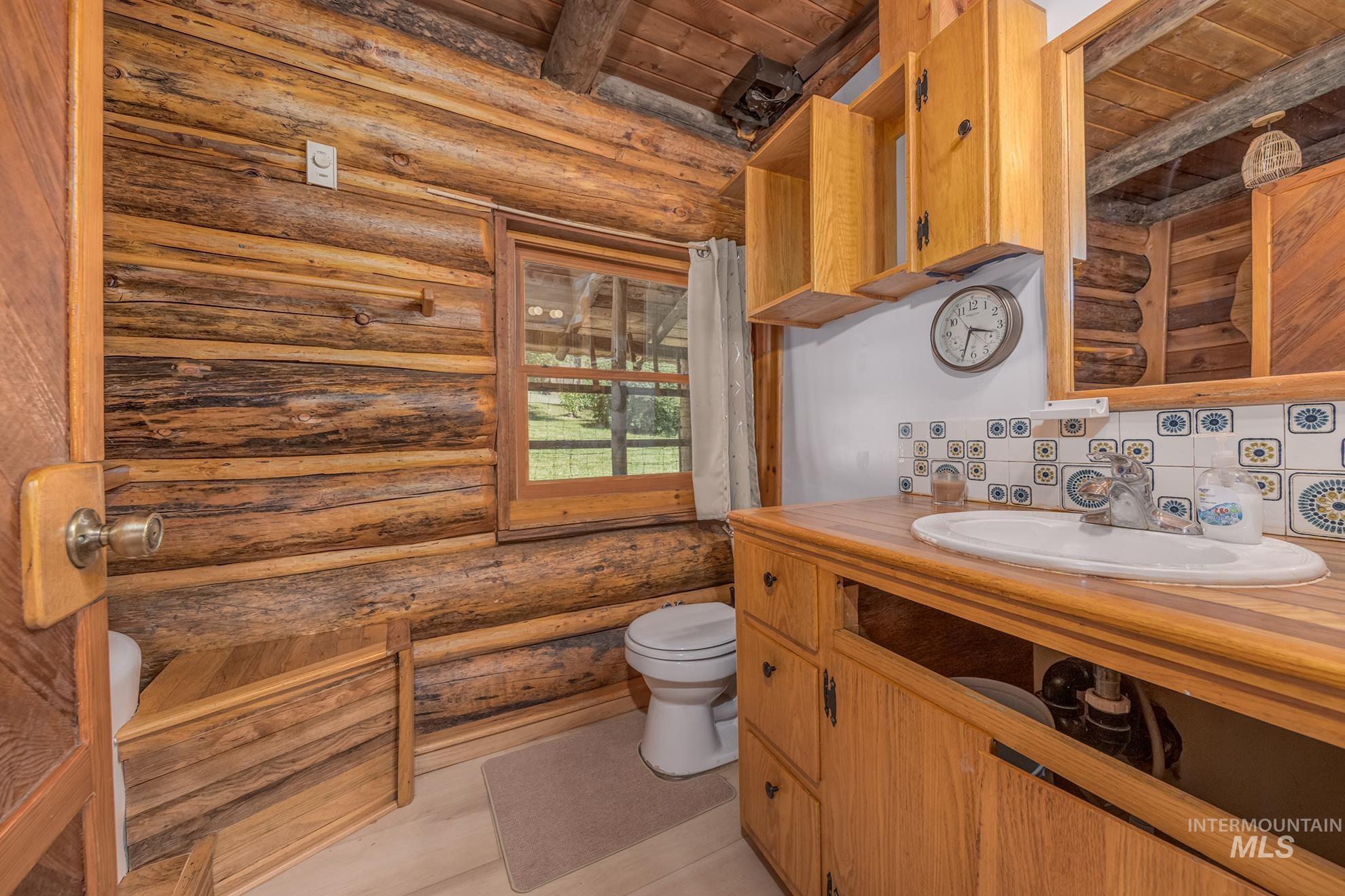 2150 Seid Creek Road Cambridge, ID 83610 - Photo 17 of 50 Log cabin interior featuring natural wood walls and ceiling beams