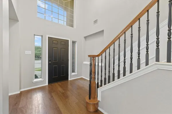 a view of staircase with wooden floor and stairs