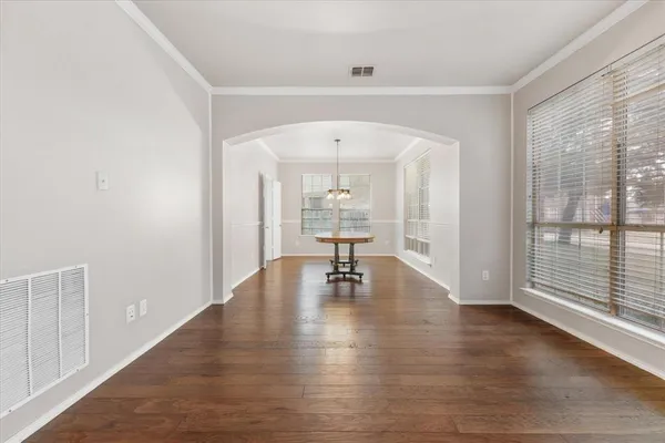 a view of an entryway with wooden floor