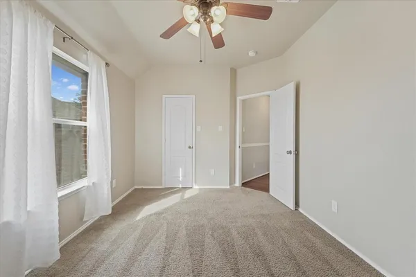 a view of hallway with chandelier and entryway