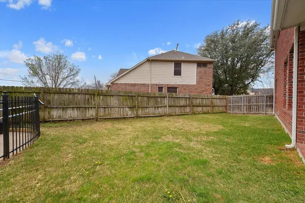 a view of backyard with green space