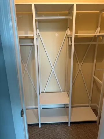 a view of a balcony with a floor to ceiling window