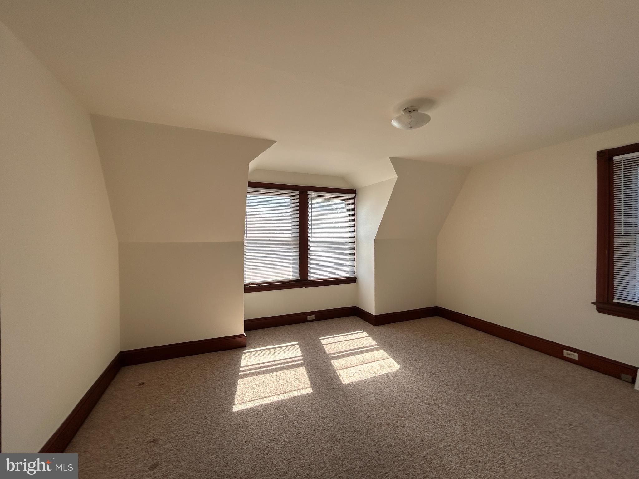 113 Dean Street, Unit 2 West Chester, PA 19382 - Photo 19 of 28 an empty room with windows