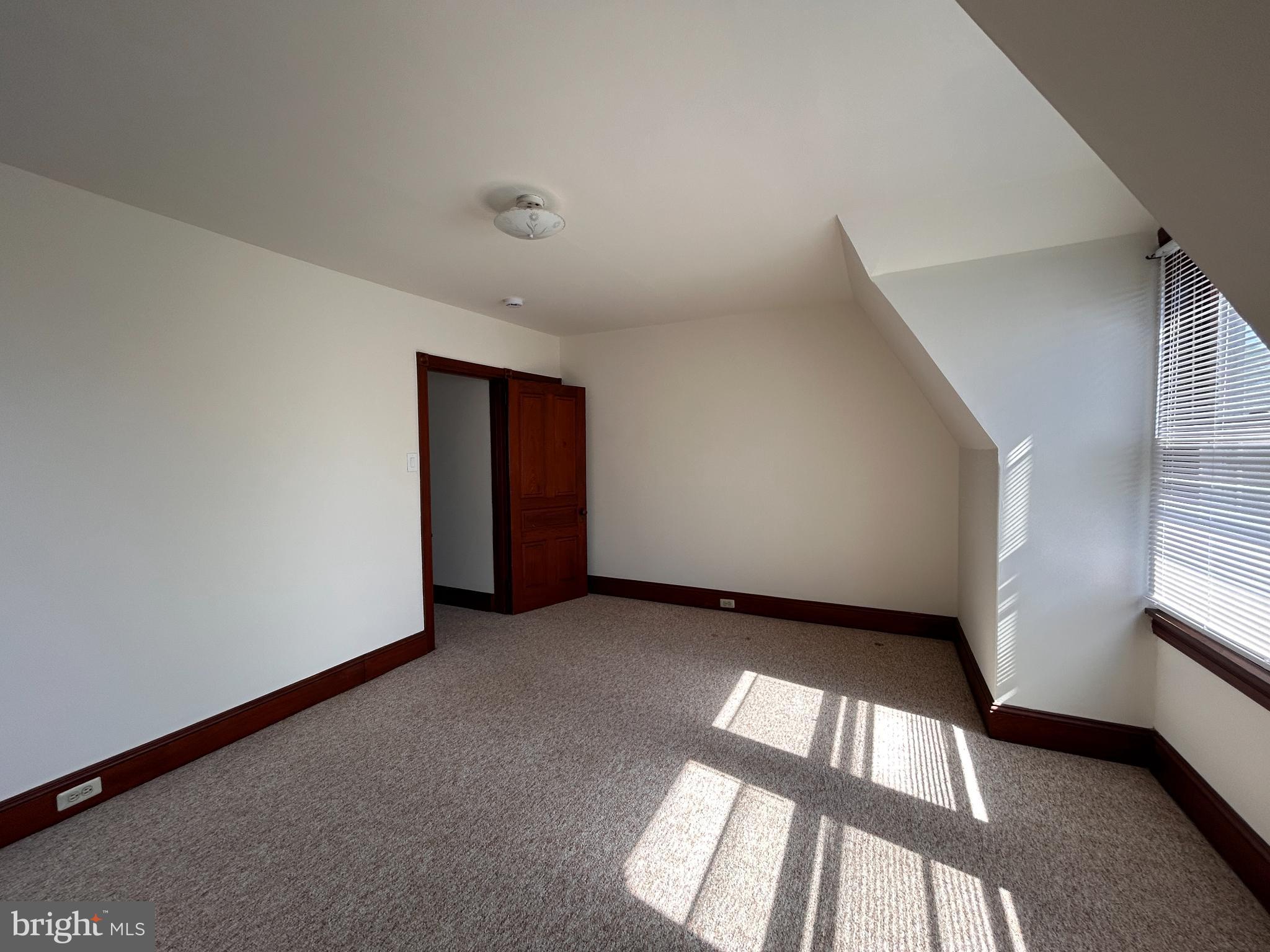 113 Dean Street, Unit 2 West Chester, PA 19382 - Photo 21 of 28 a view of an empty room with a window