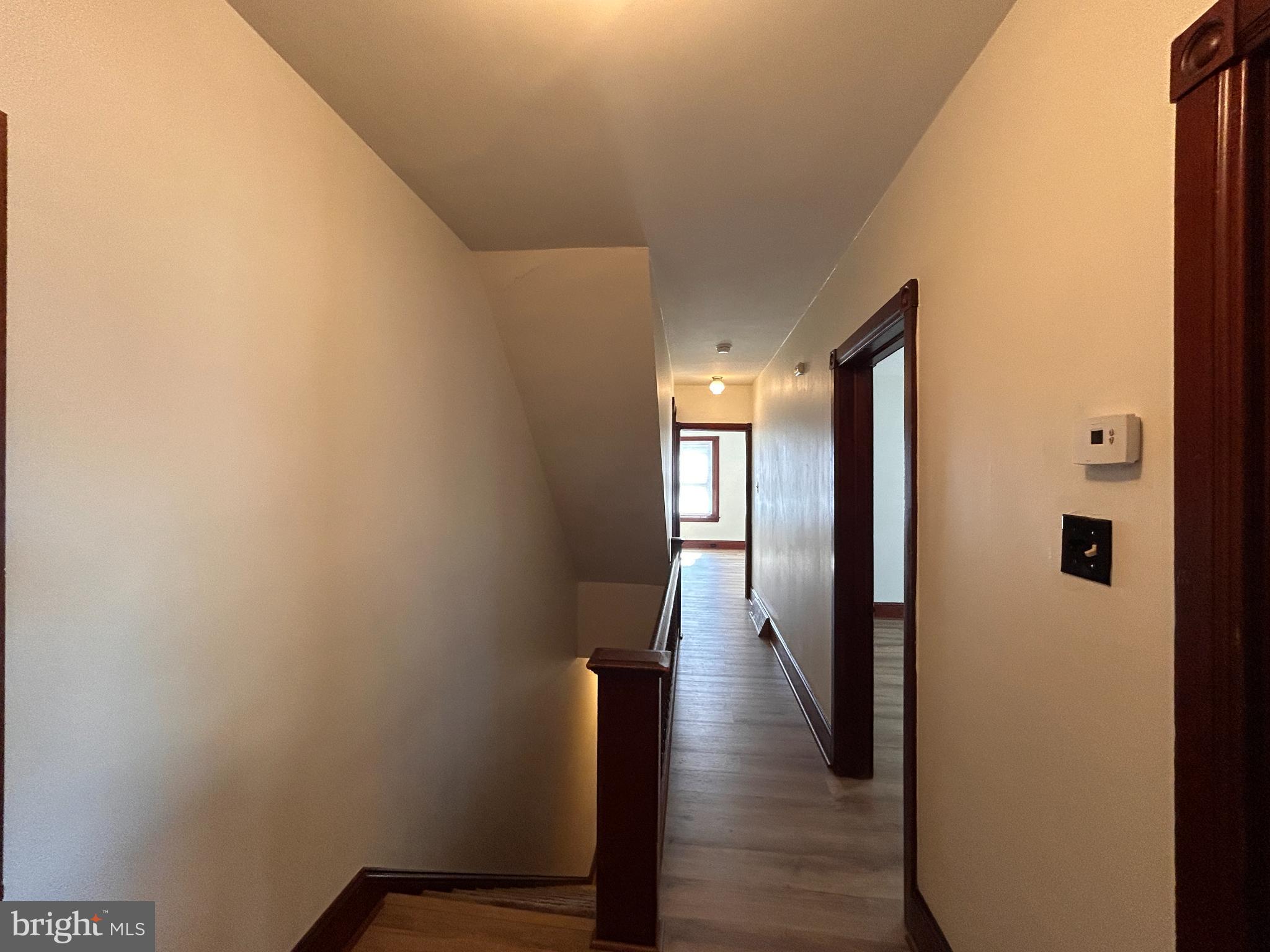 113 Dean Street, Unit 2 West Chester, PA 19382 - Photo 24 of 28 a view of a hallway with wooden floor