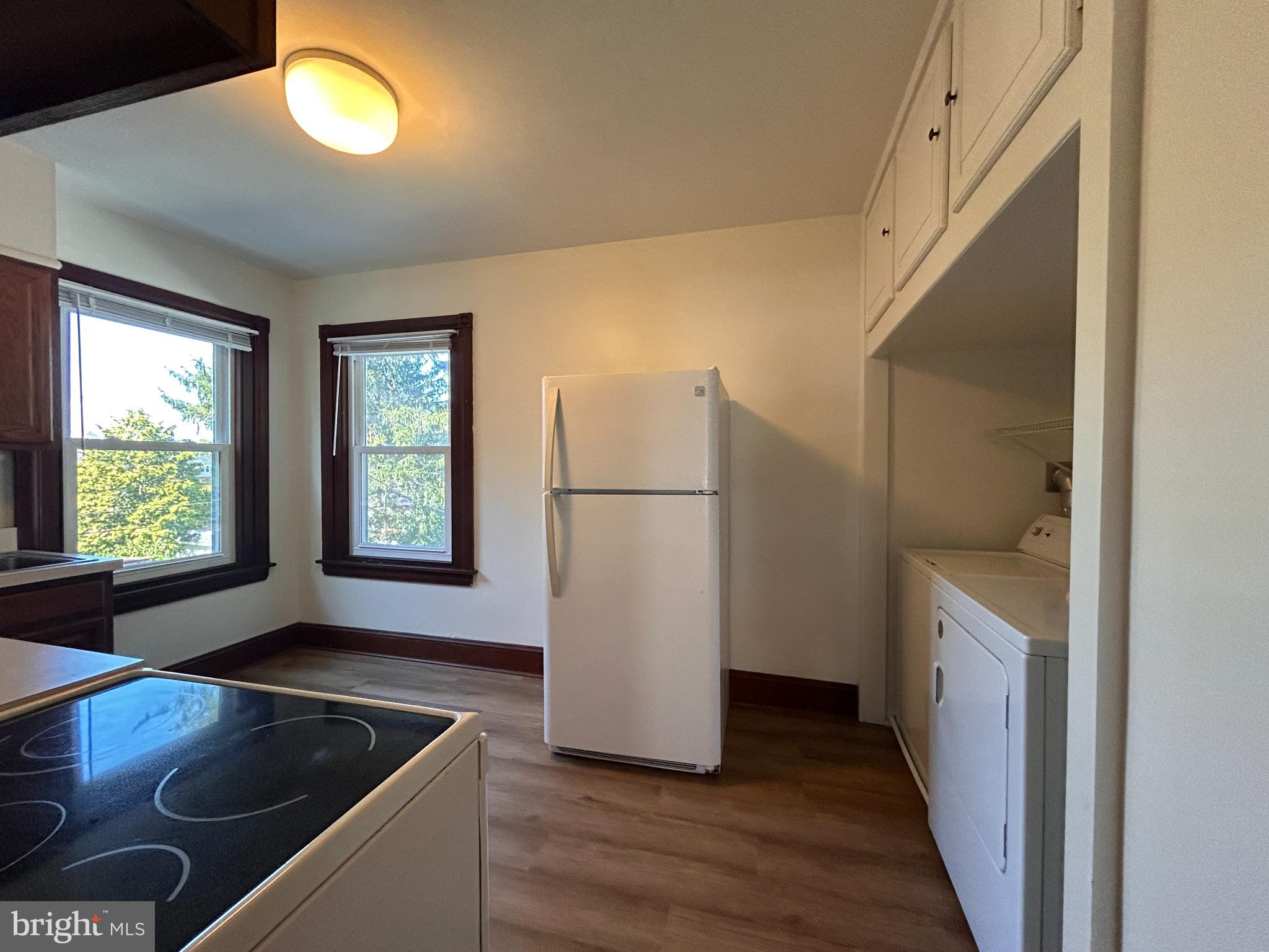 113 Dean Street, Unit 2 West Chester, PA 19382 - Photo 7 of 28 a kitchen with a refrigerator and a sink