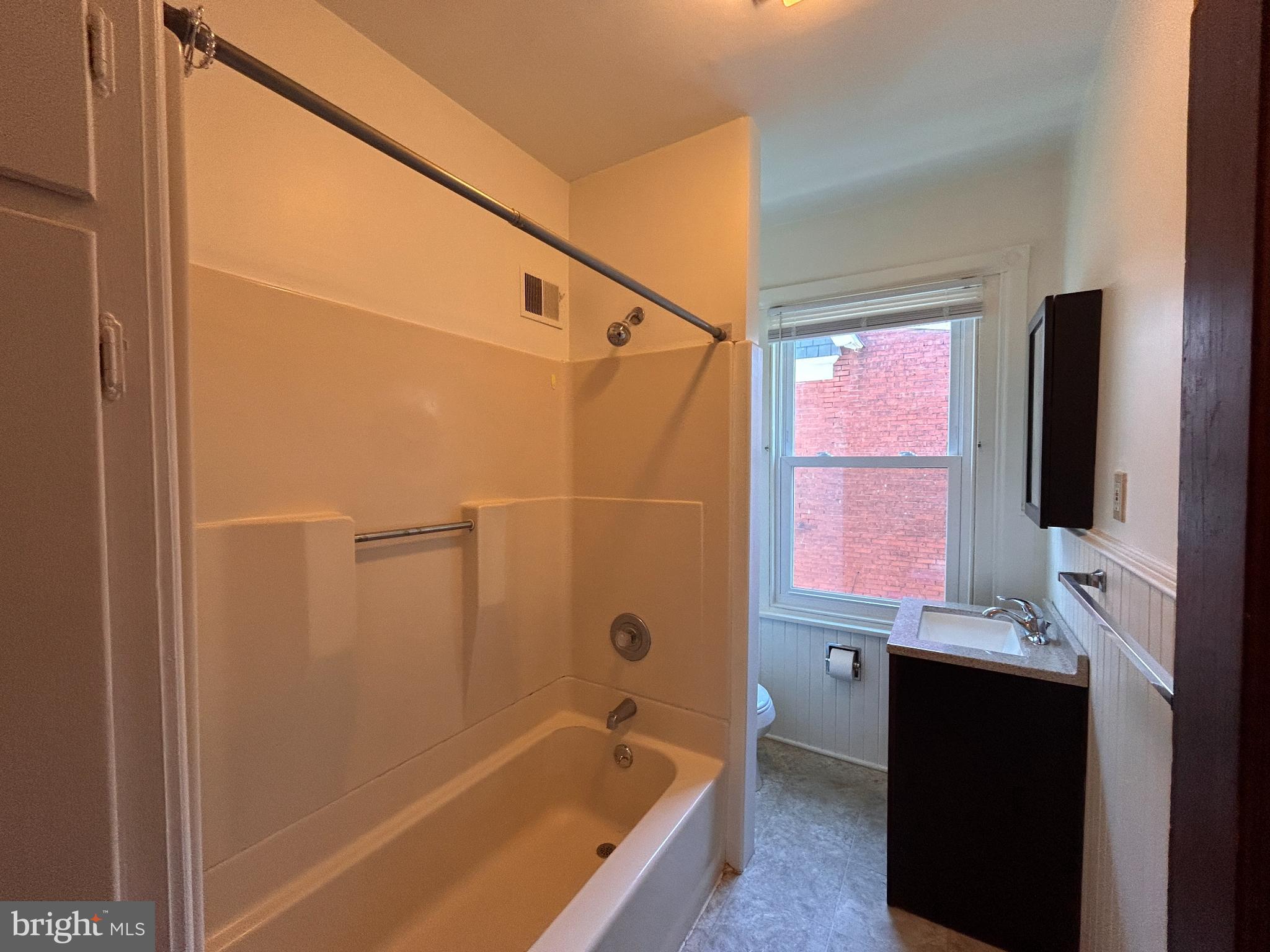 113 Dean Street, Unit 2 West Chester, PA 19382 - Photo 9 of 28 a bathroom with a bathtub and a shower