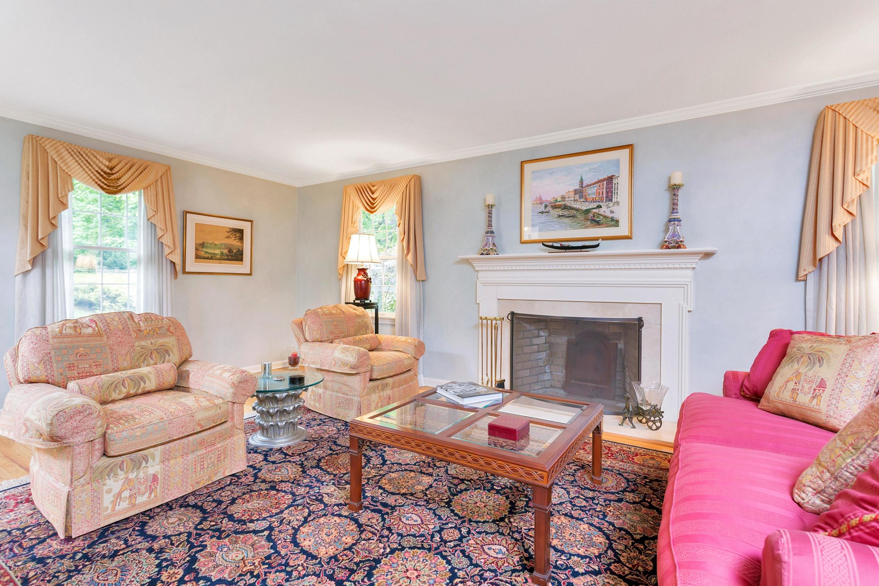 123 Tokeneke Road Darien, CT 06820 - Photo 12 of 23 a living room with furniture and a fireplace