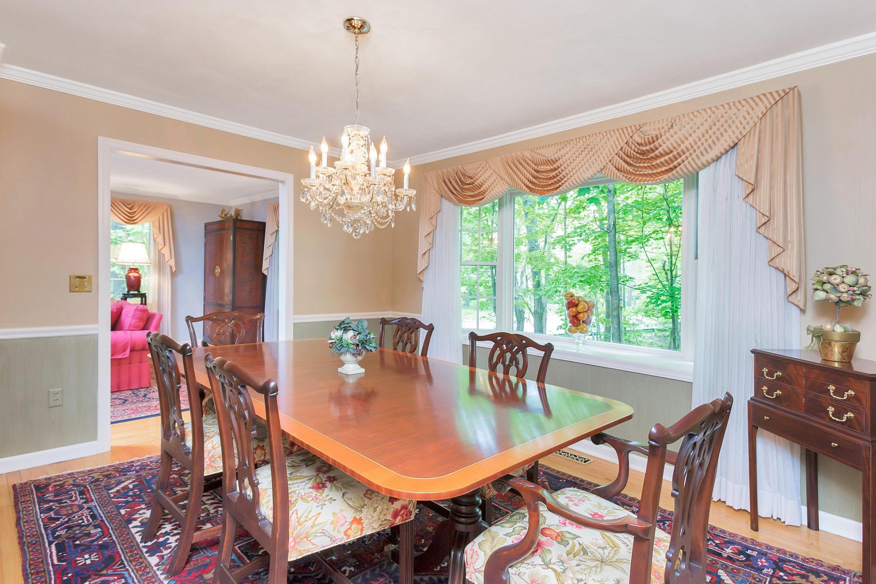 123 Tokeneke Road Darien, CT 06820 - Photo 14 of 23 a dining room with furniture a chandelier and wooden floor