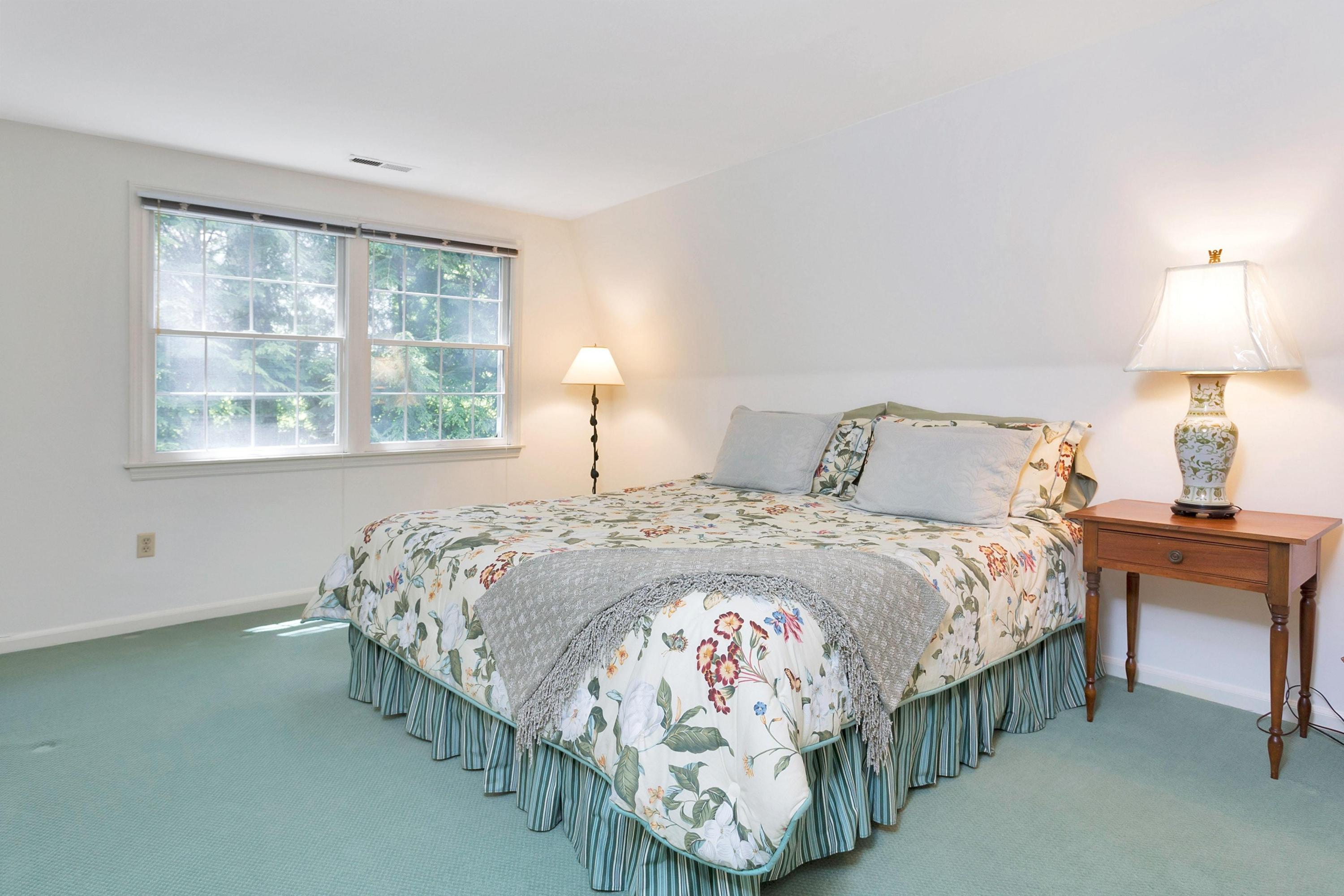 123 Tokeneke Road Darien, CT 06820 - Photo 17 of 23 a bedroom with a bed and a window