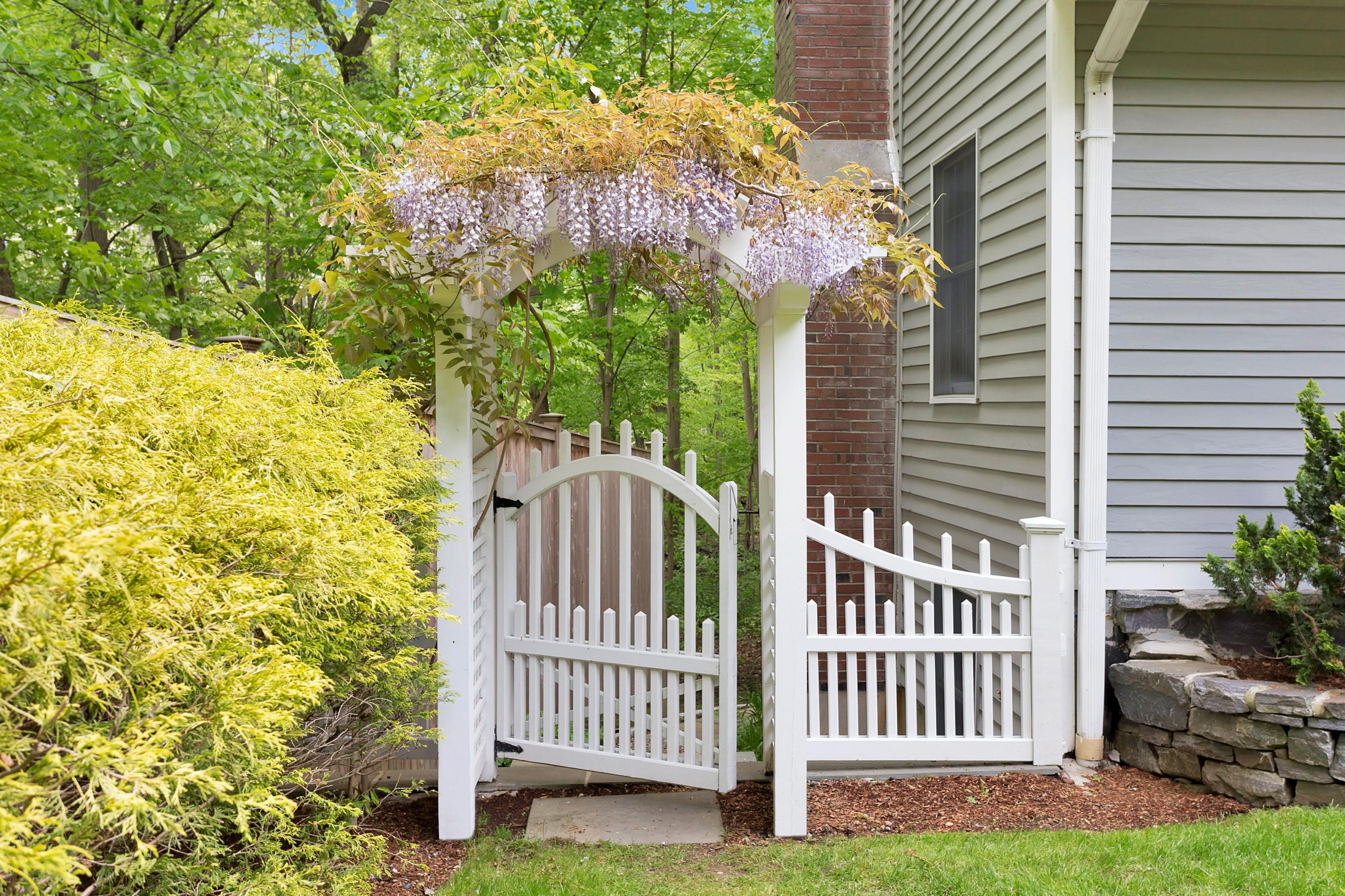 123 Tokeneke Road Darien, CT 06820 - Photo 4 of 23 a view of a porch with a bench