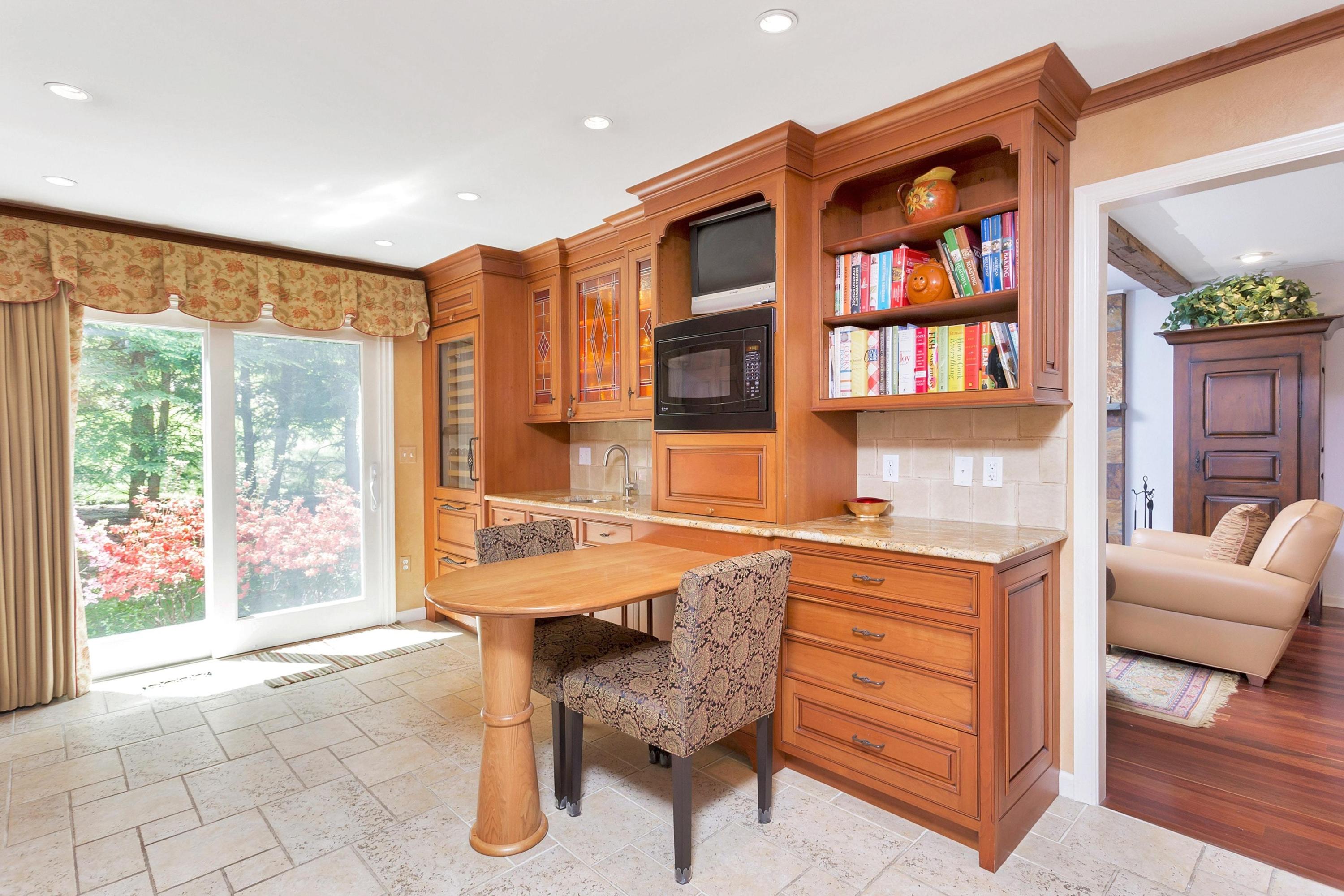 123 Tokeneke Road Darien, CT 06820 - Photo 9 of 23 a dining room with a table and chairs