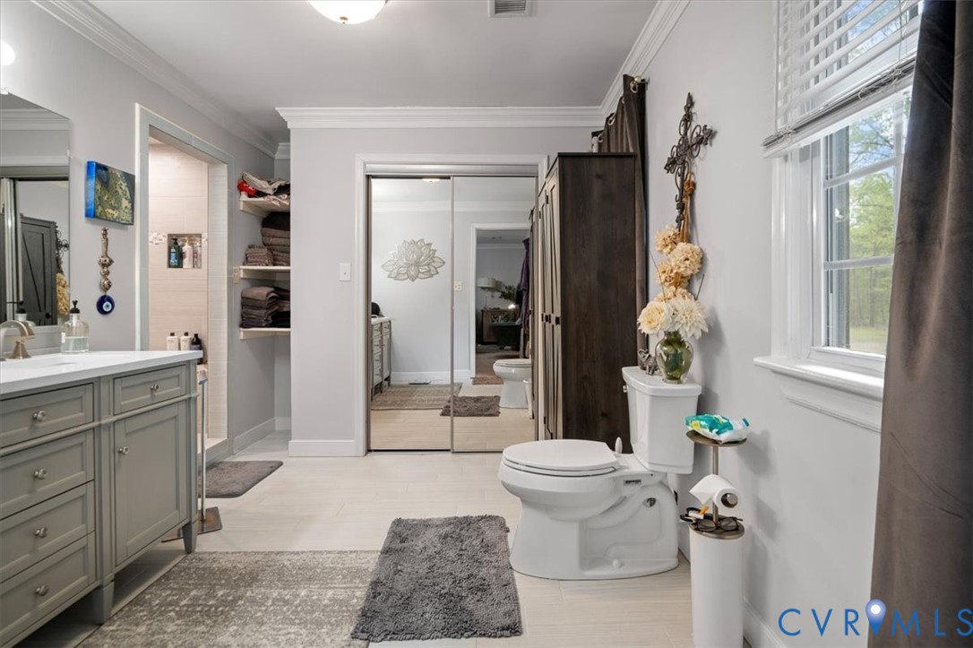 9820 Beaver Bridge Road Chesterfield, VA 23838 - Photo 38 of 54 Spacious bathroom featuring a light gray vanity wi