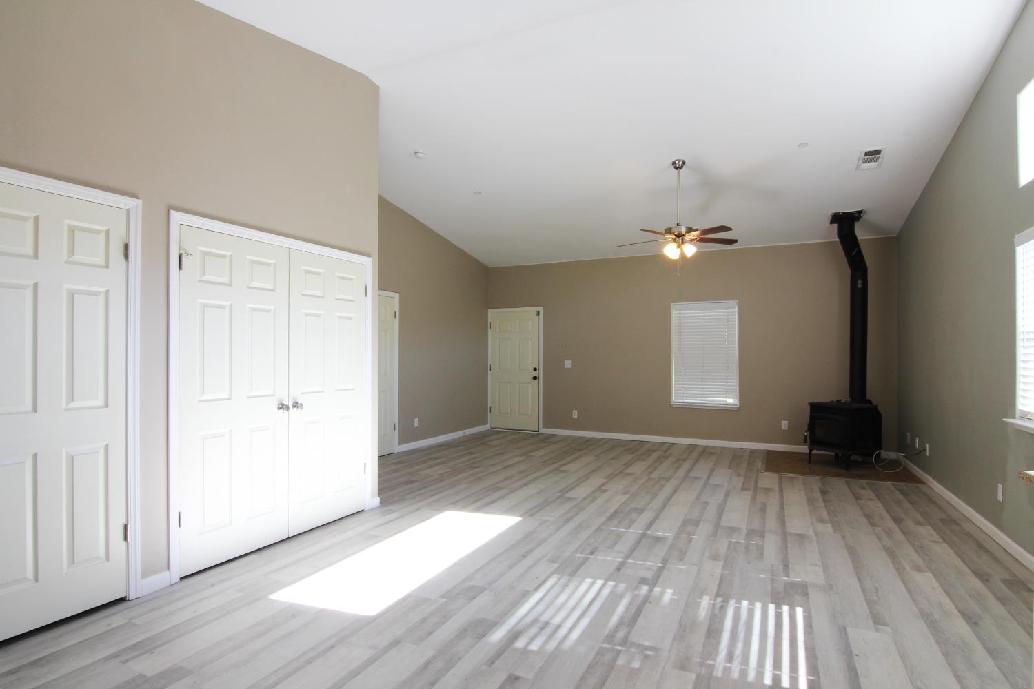 4968 Yaqui Gulch Road Mariposa, CA 95338 - Photo 11 of 28 wooden floor in an empty room with a window