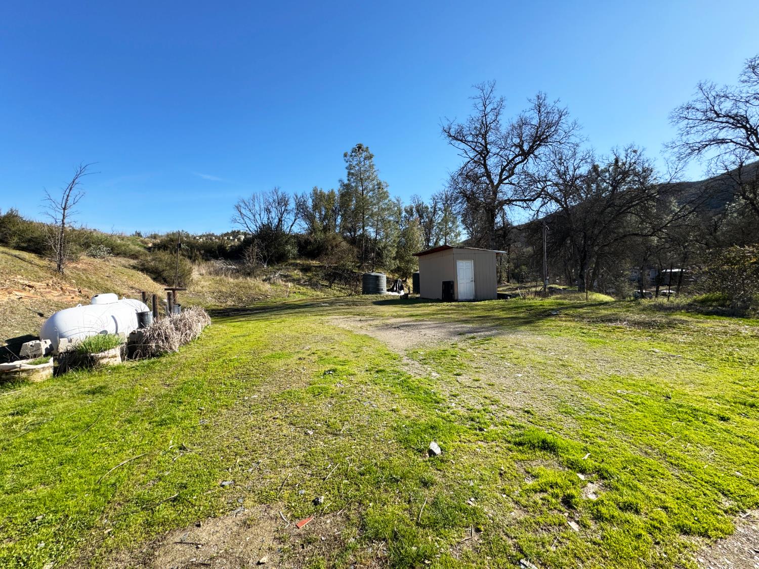 4968 Yaqui Gulch Road Mariposa, CA 95338 - Photo 34 of 35 a view of a swimming pool with a yard