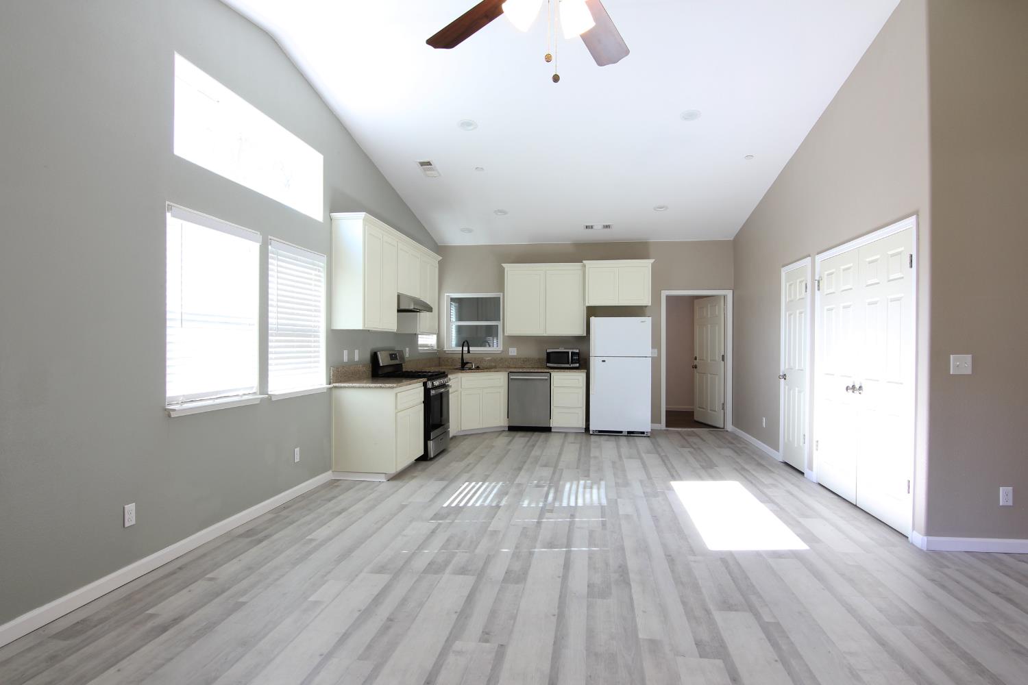 4968 Yaqui Gulch Road Mariposa, CA 95338 - Photo 6 of 28 a view of kitchen with wooden floor electronic appliances and window