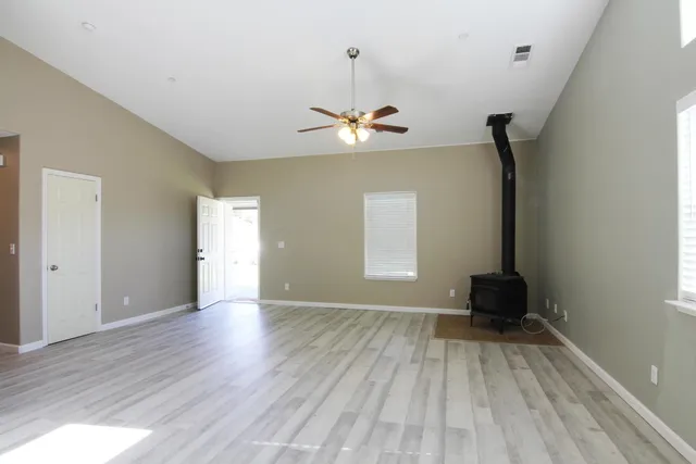 a kitchen with a refrigerator sink and cabinets