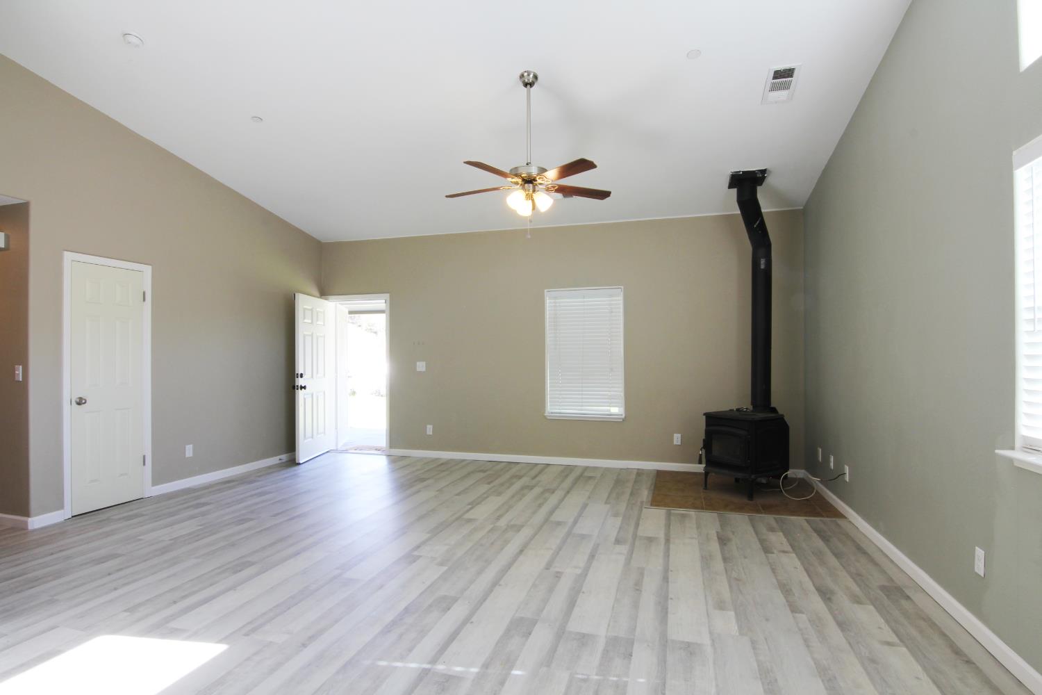 4968 Yaqui Gulch Road Mariposa, CA 95338 - Photo 8 of 28 wooden floor in an empty room with a window