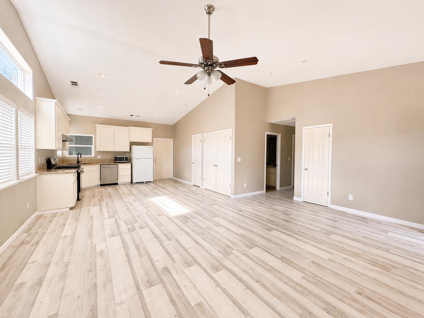 4968 Yaqui Gulch Road Mariposa, CA 95338 - Photo 8 of 35 a view of a living room hardwood floor and a ceiling fan