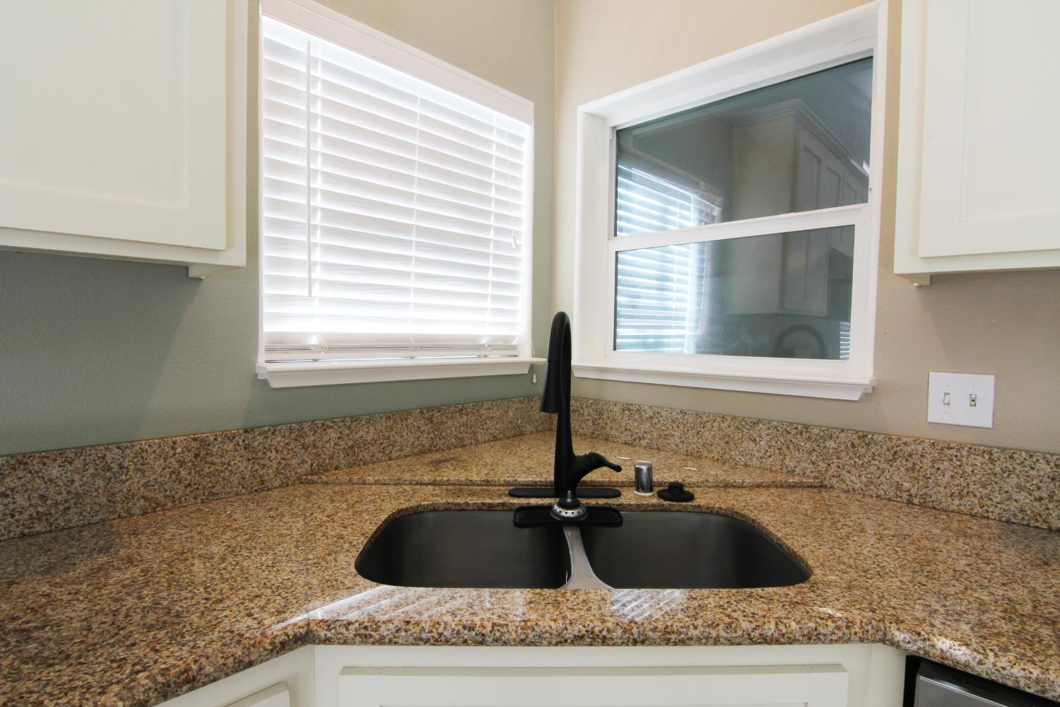 4968 Yaqui Gulch Road Mariposa, CA 95338 - Photo 10 of 28 a bathroom with a granite countertop sink and window