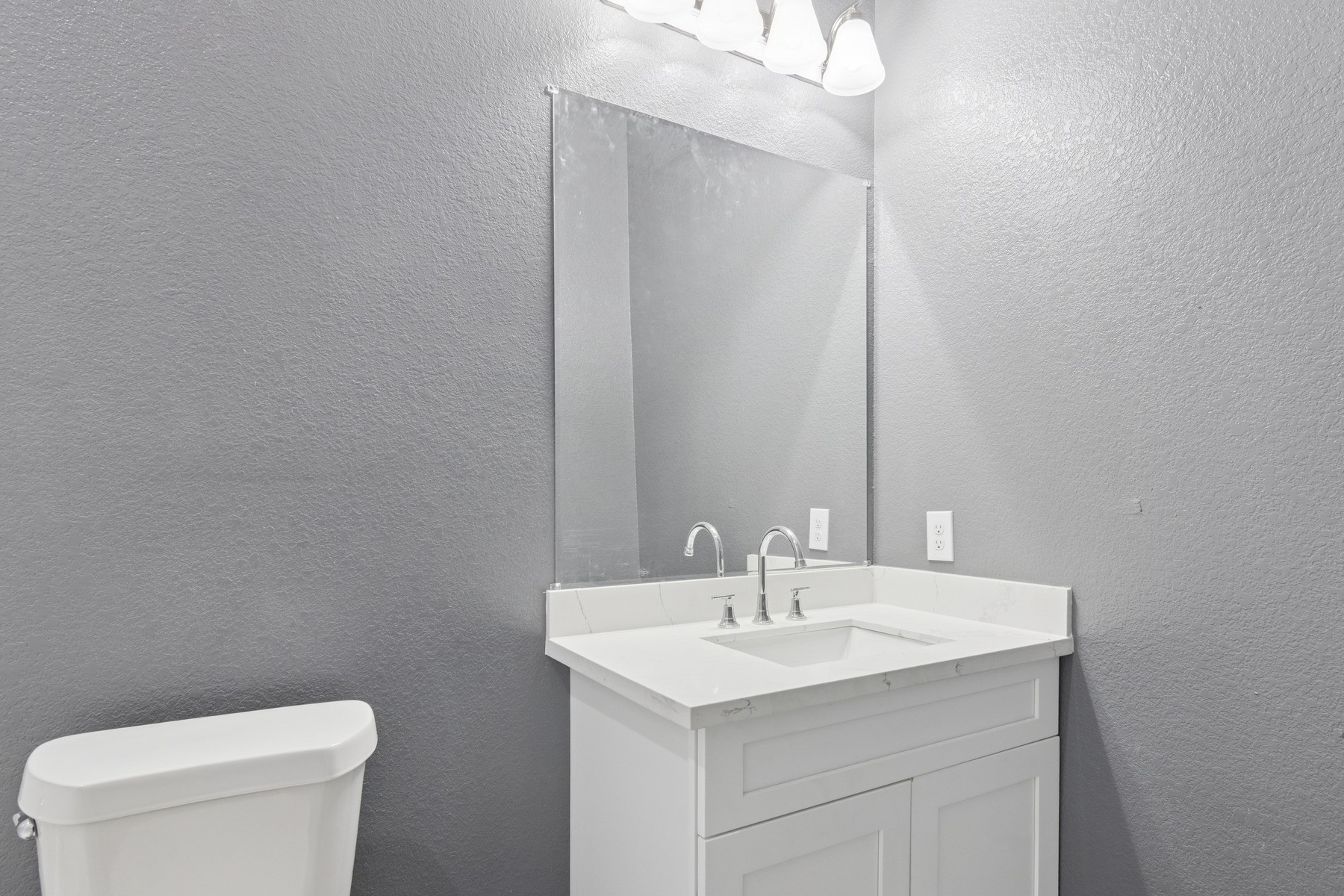 4704 Ward Street Houston, TX 77021 - Photo 13 of 20 a bathroom with a sink a toilet and a mirror