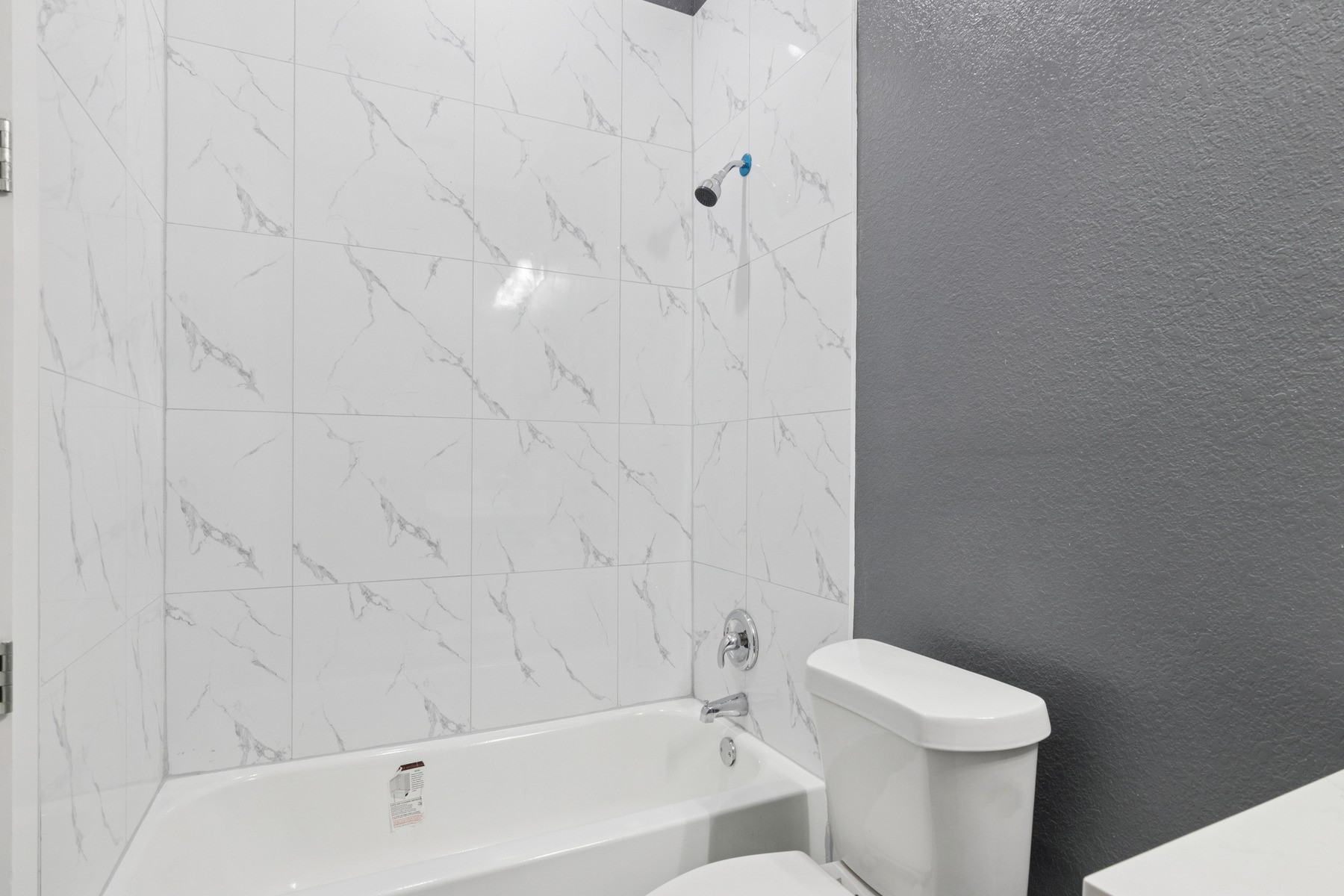 4704 Ward Street Houston, TX 77021 - Photo 14 of 20 a bathroom with a toilet and a bathtub