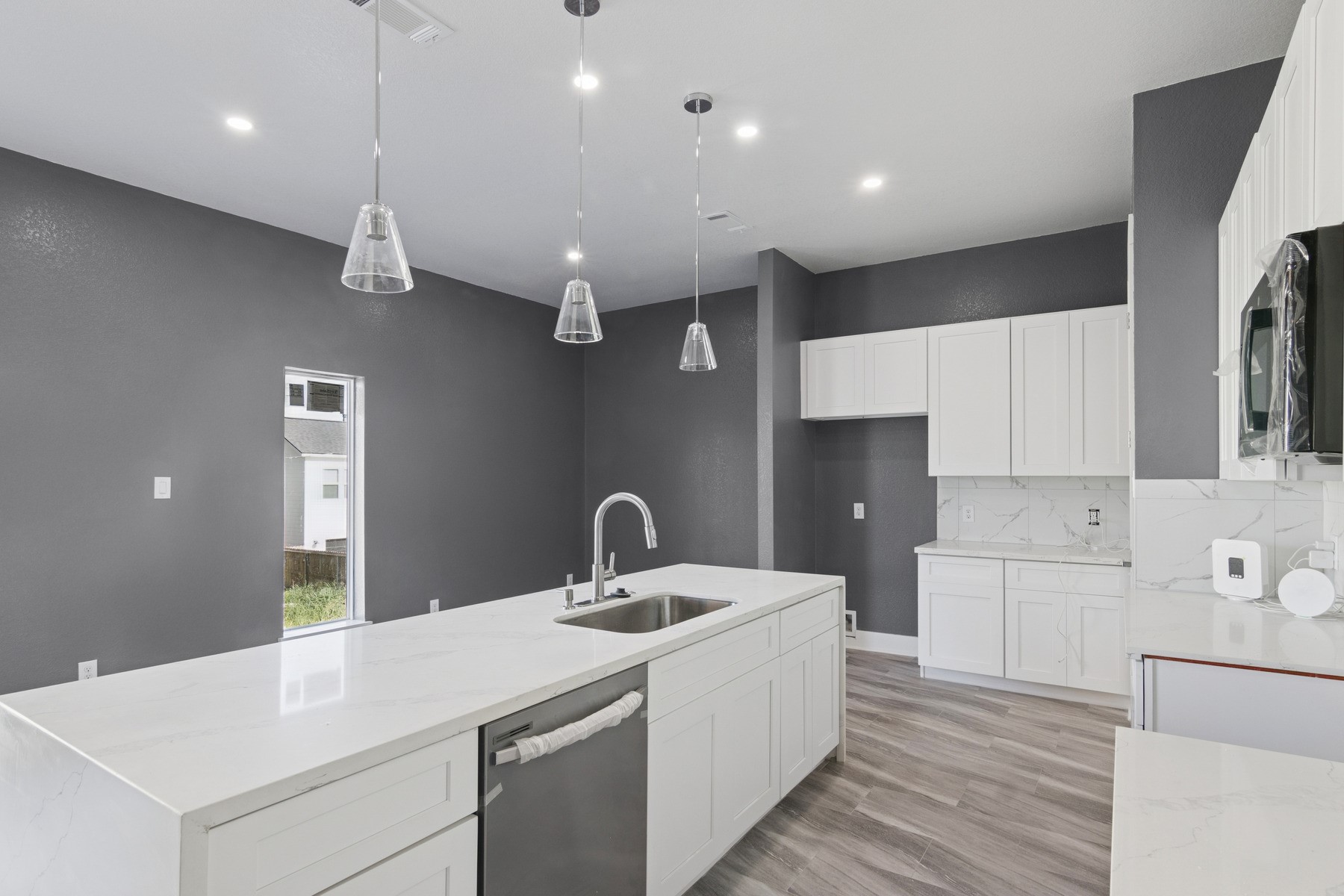 4704 Ward Street Houston, TX 77021 - Photo 5 of 20 a kitchen with a sink a refrigerator and window
