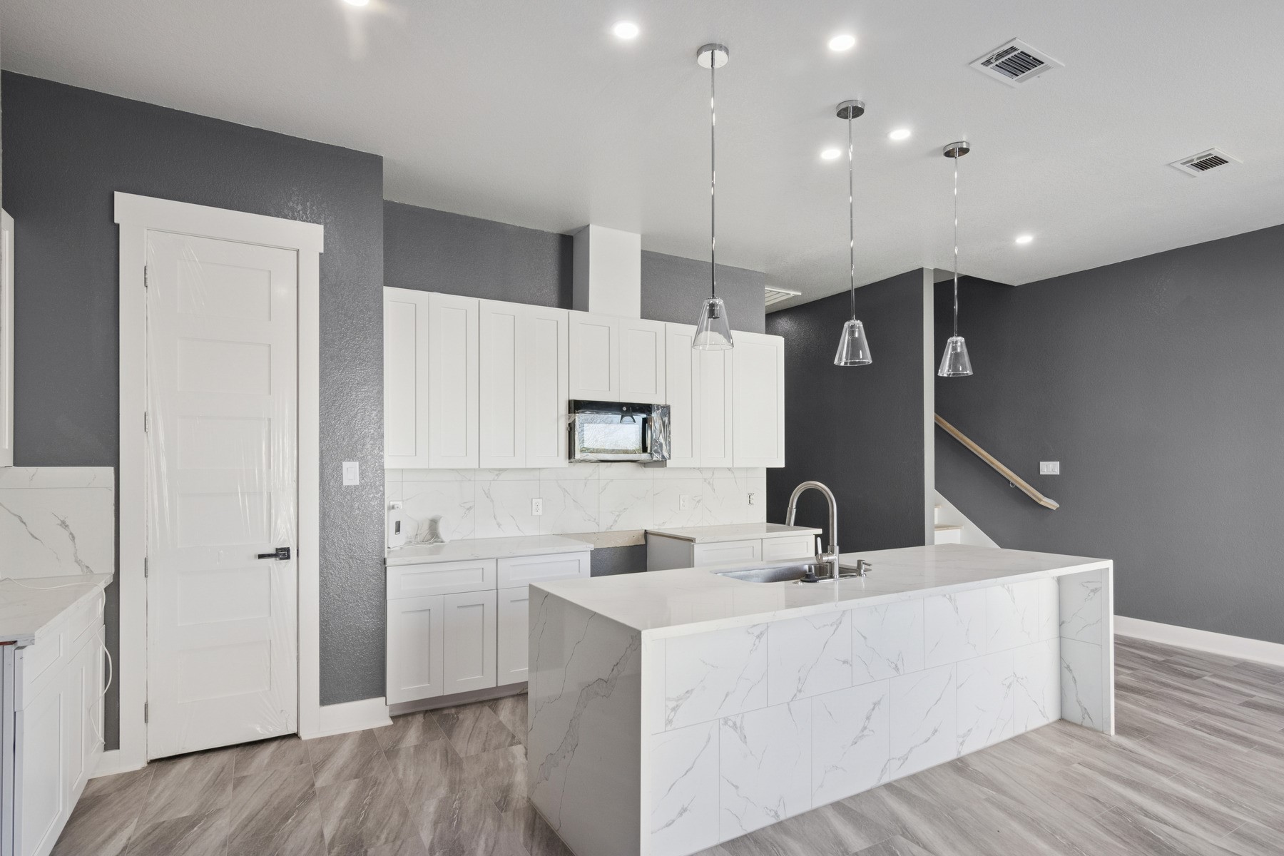 4704 Ward Street Houston, TX 77021 - Photo 7 of 20 a kitchen with stainless steel appliances kitchen island a sink and a refrigerator