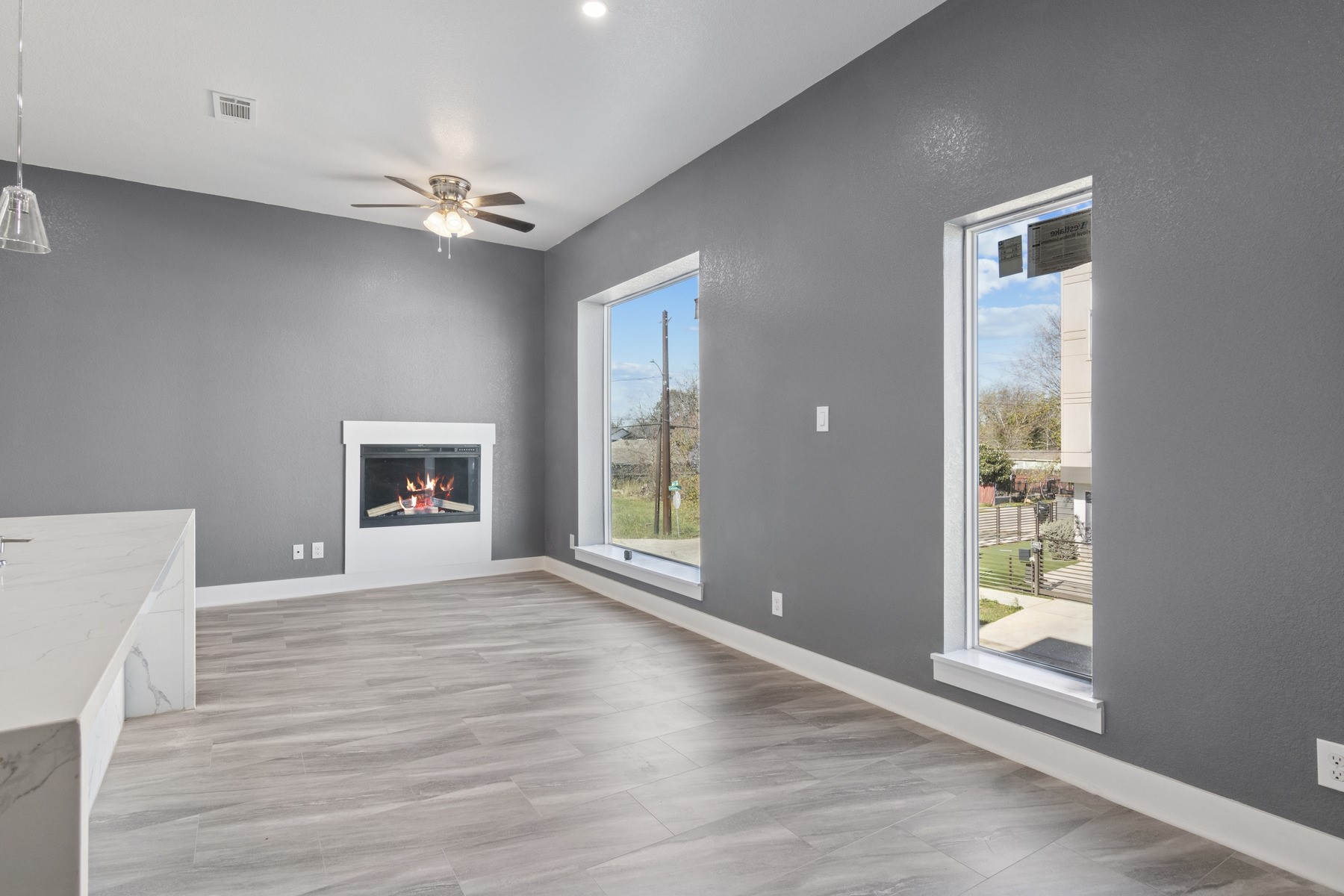 4704 Ward Street Houston, TX 77021 - Photo 8 of 20 a view of an empty room with a window and wooden floor