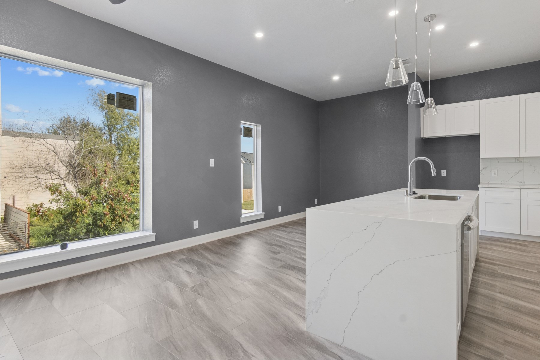 4704 Ward Street Houston, TX 77021 - Photo 10 of 20 a kitchen with kitchen island a sink appliances and a large window