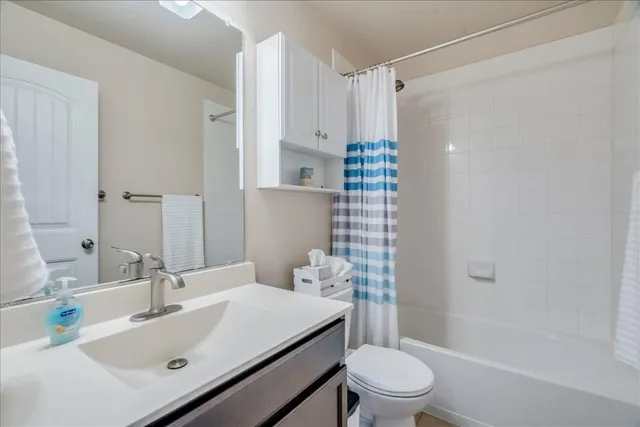 a workspace with wooden floor and a window