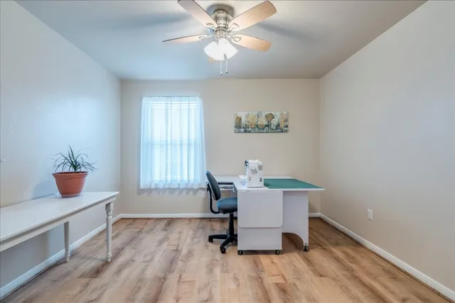 a workspace with furniture hardwood and a kitchen