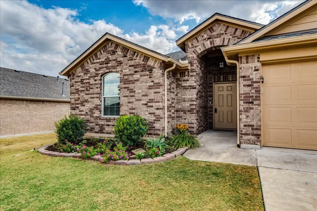 front view of a house with a yard