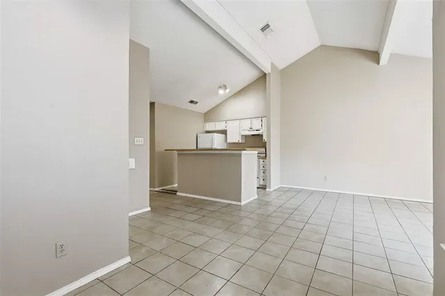 a view of kitchen with white cabinets