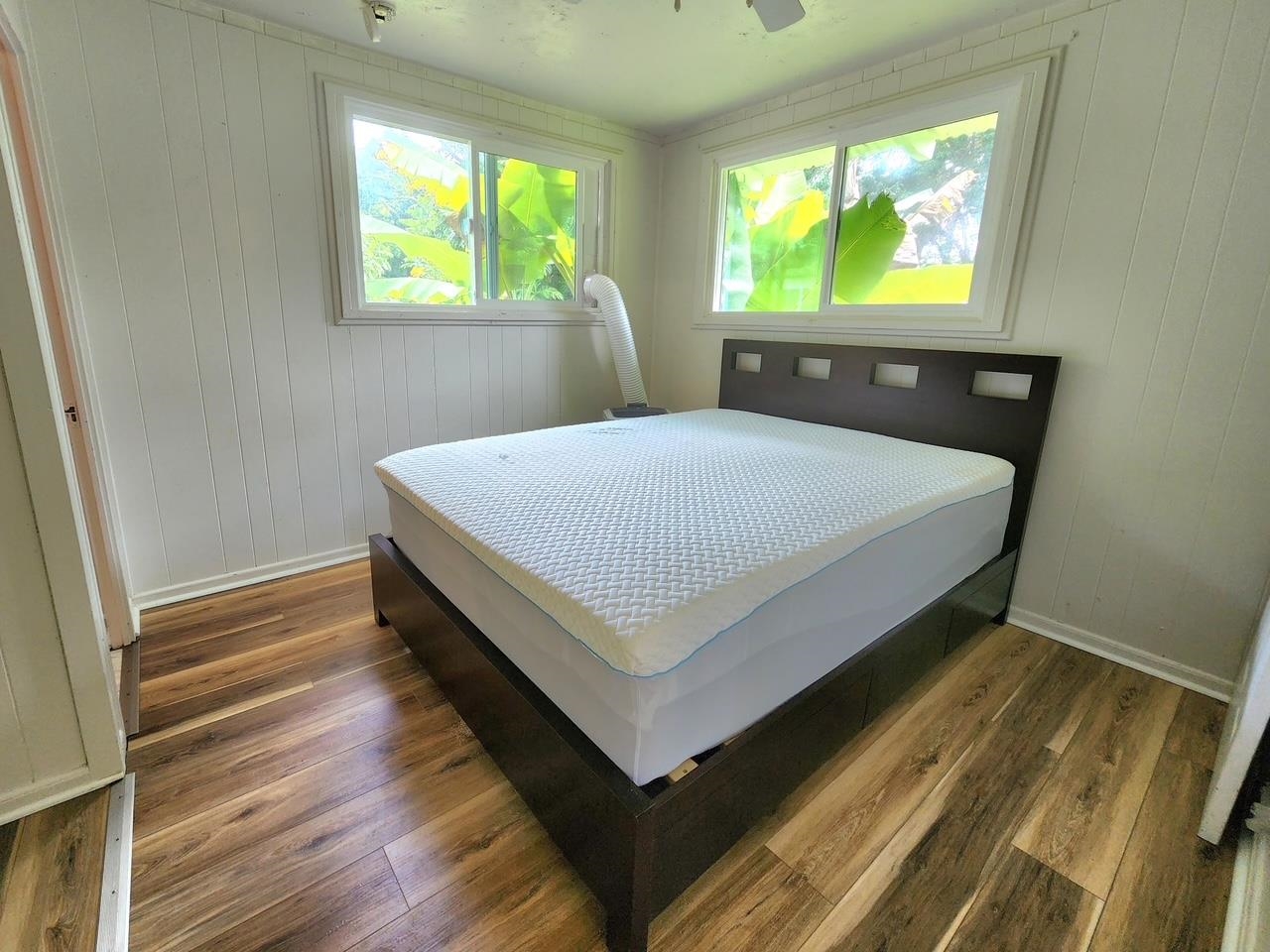 91 Wailua Road Haiku, HI 96708 - Photo 12 of 14 a bed sitting in a bedroom next to a window