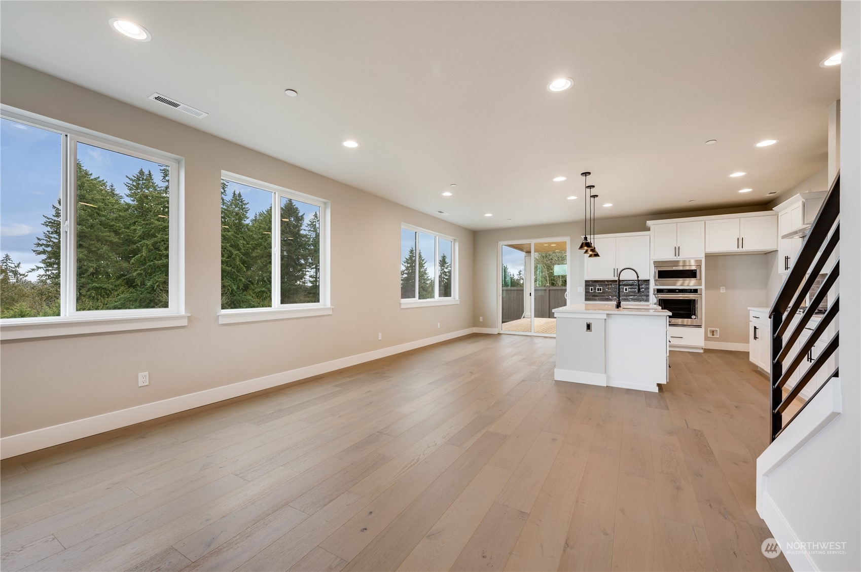 24326 43rd Drive Southeast Bothell, WA 98021 - Photo 16 of 35 a view of an empty room with wooden floor and a window