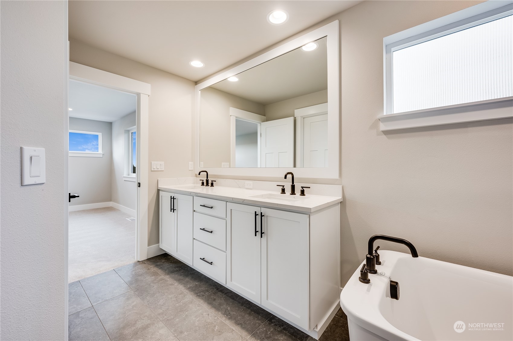 24326 43rd Drive Southeast Bothell, WA 98021 - Photo 29 of 35 a bathroom with a double vanity sink mirror and bathtub