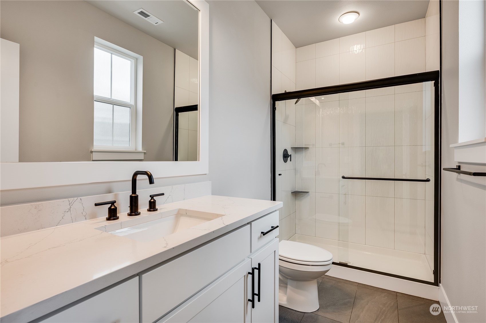 24326 43rd Drive Southeast Bothell, WA 98021 - Photo 6 of 35 a bathroom with a sink a toilet and a mirror