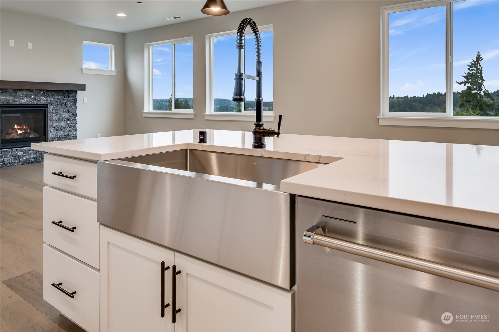 24326 43rd Drive Southeast Bothell, WA 98021 - Photo 10 of 35 a kitchen with white cabinets and a sink