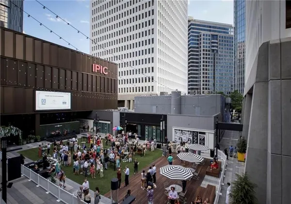 a view of a chairs and table in backyard