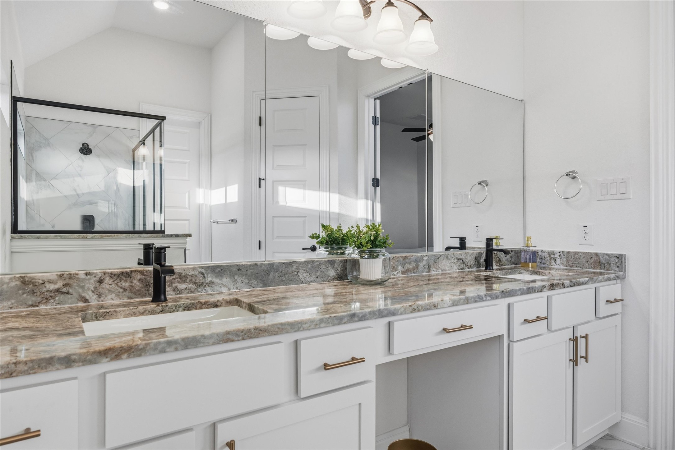 a bathroom with double sink and a mirror