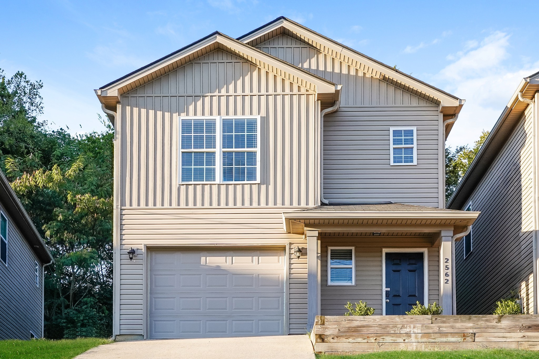 a front view of a house with a yard