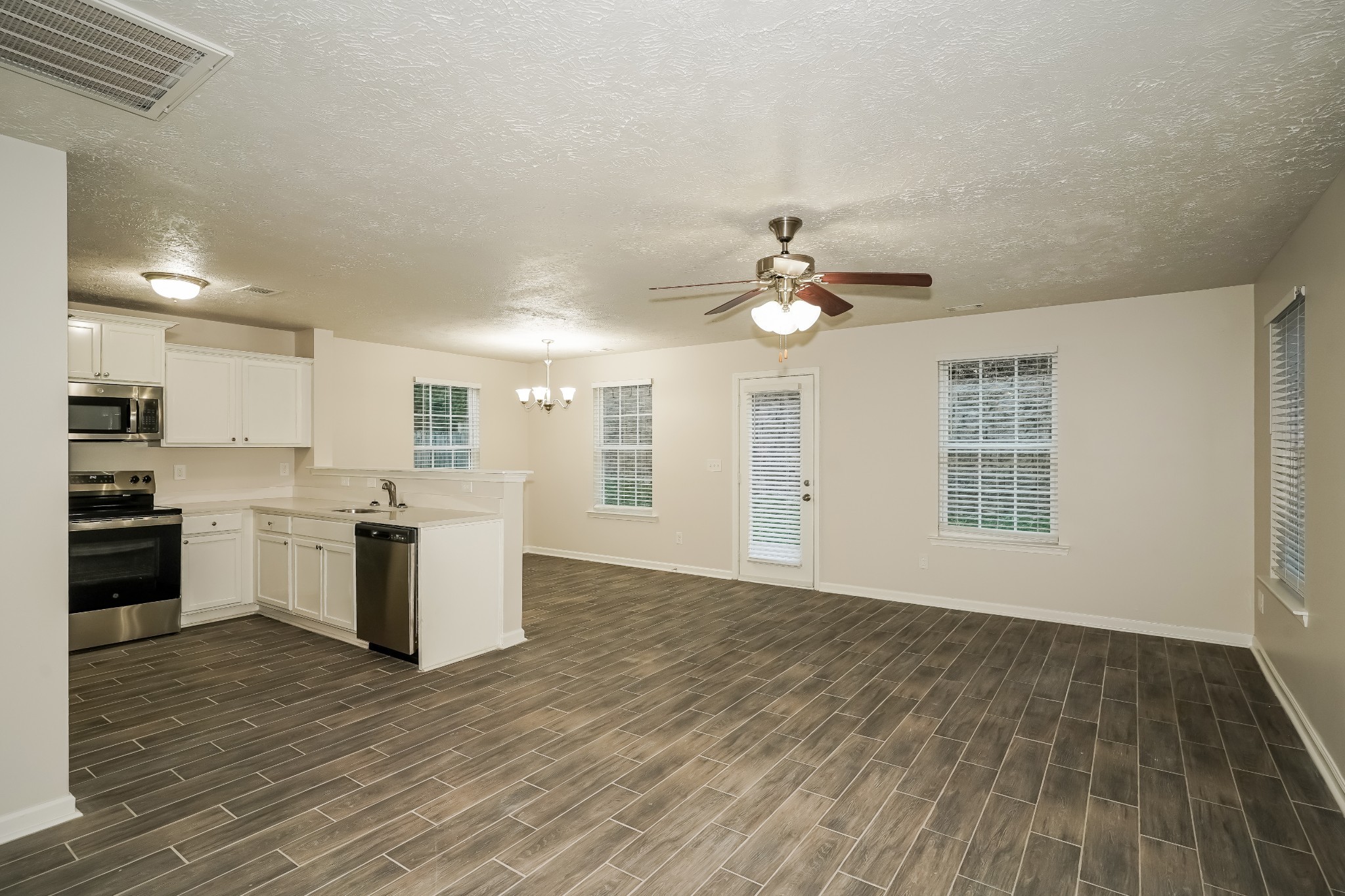 2562 Willow Branch Drive Nashville, TN 37217 - Photo 2 of 17 a view of an empty room with kitchen and a window