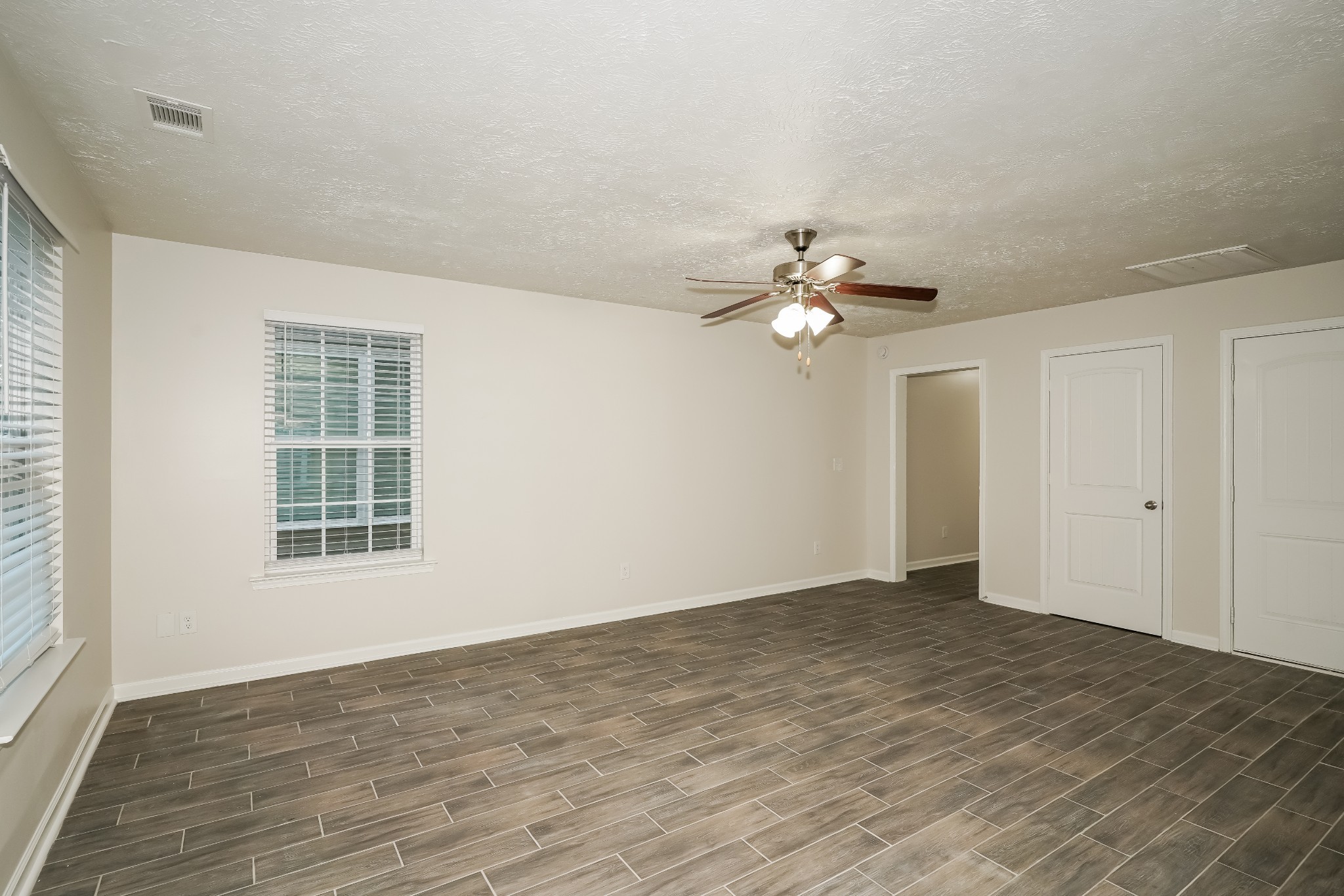 2562 Willow Branch Drive Nashville, TN 37217 - Photo 3 of 17 a view of an empty room with wooden floor and a window