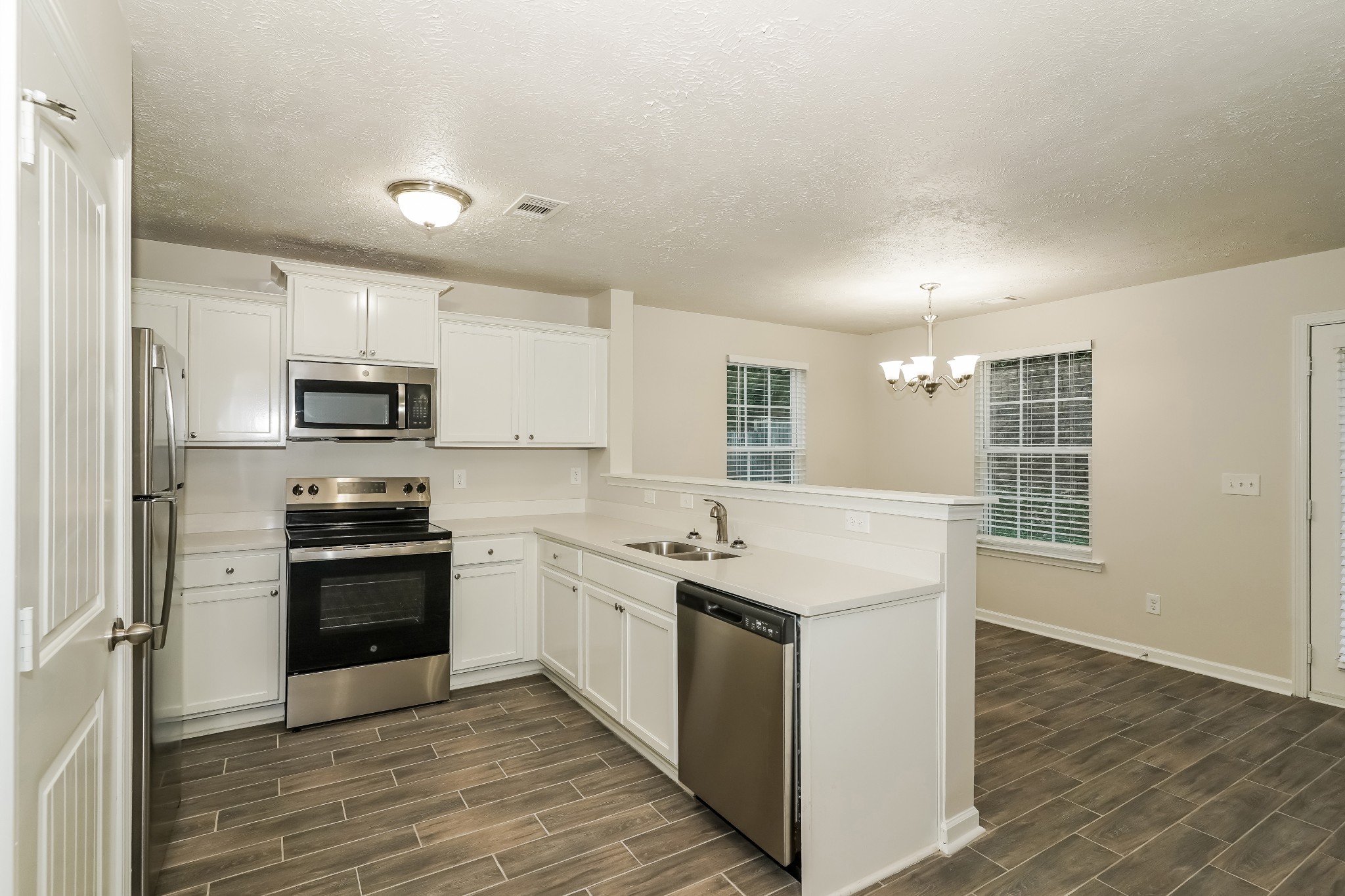 2562 Willow Branch Drive Nashville, TN 37217 - Photo 6 of 17 a kitchen with stainless steel appliances granite countertop a stove and a sink