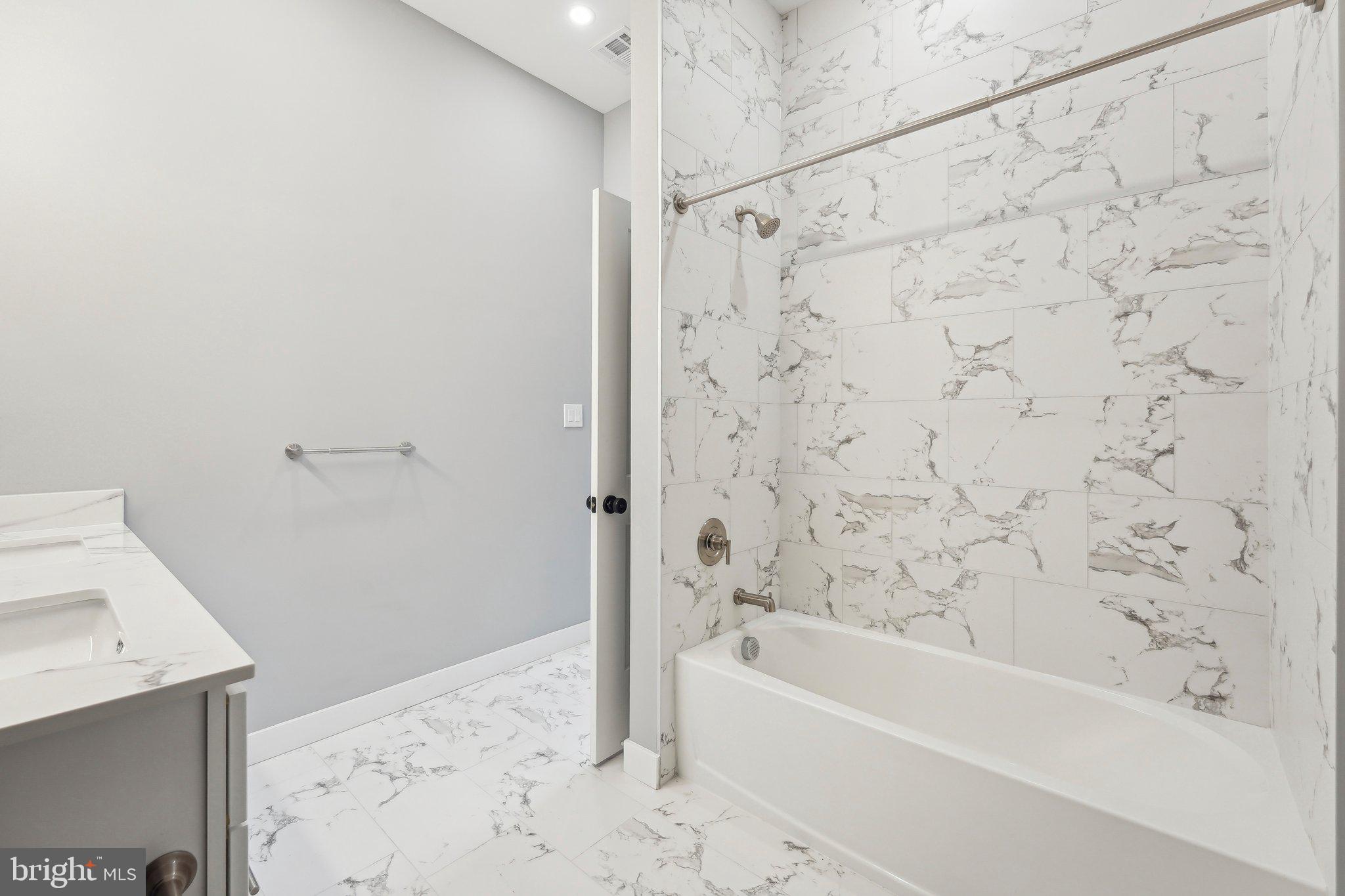 2421 Bristol Road, Unit 2B310 Warrington, PA 18976 - Photo 43 of 50 a bathroom with a bathtub and a shower