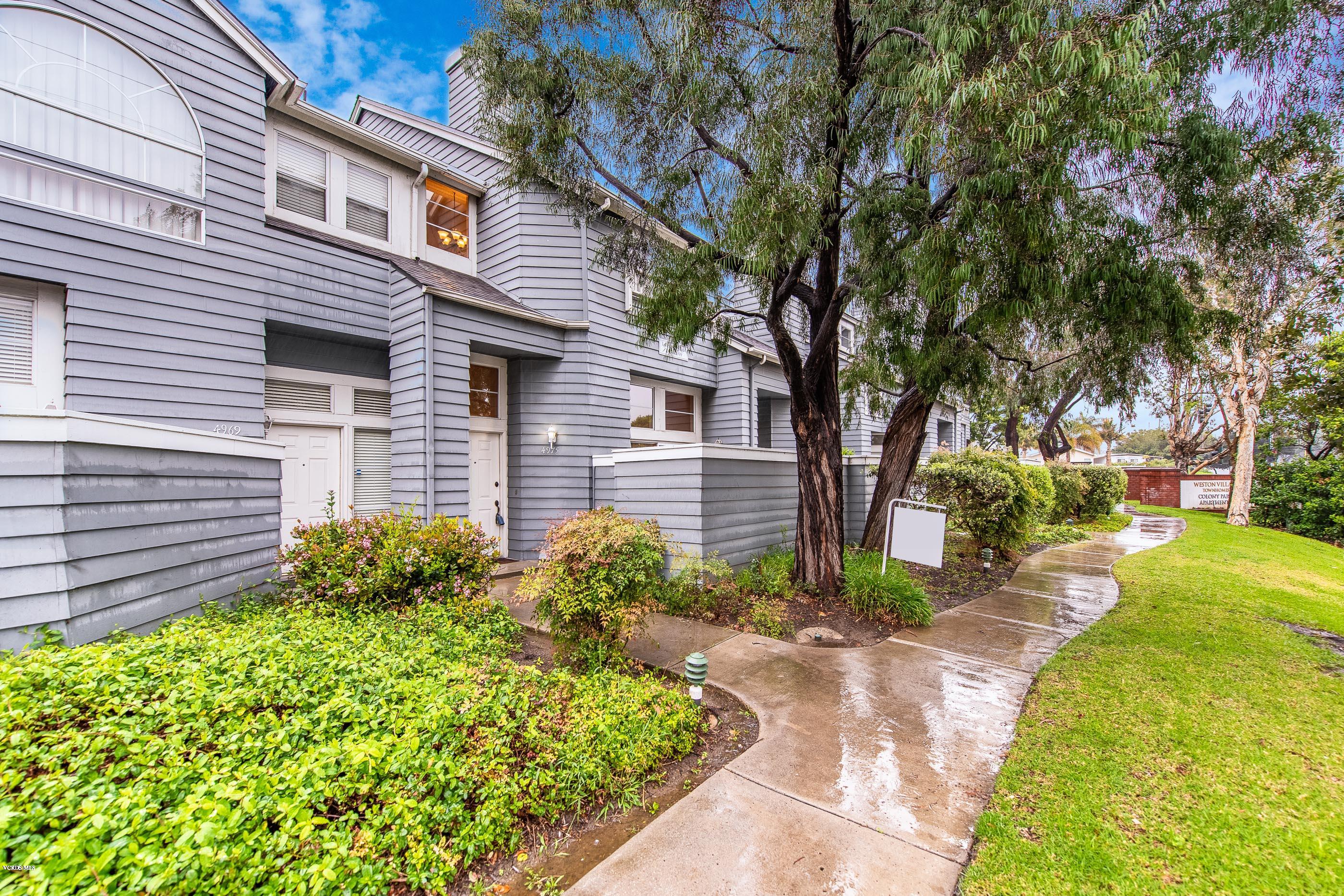 4975 Telephone Road Ventura, CA 93003 - Photo 1 of 31 a view of a backyard with plants and a large tree