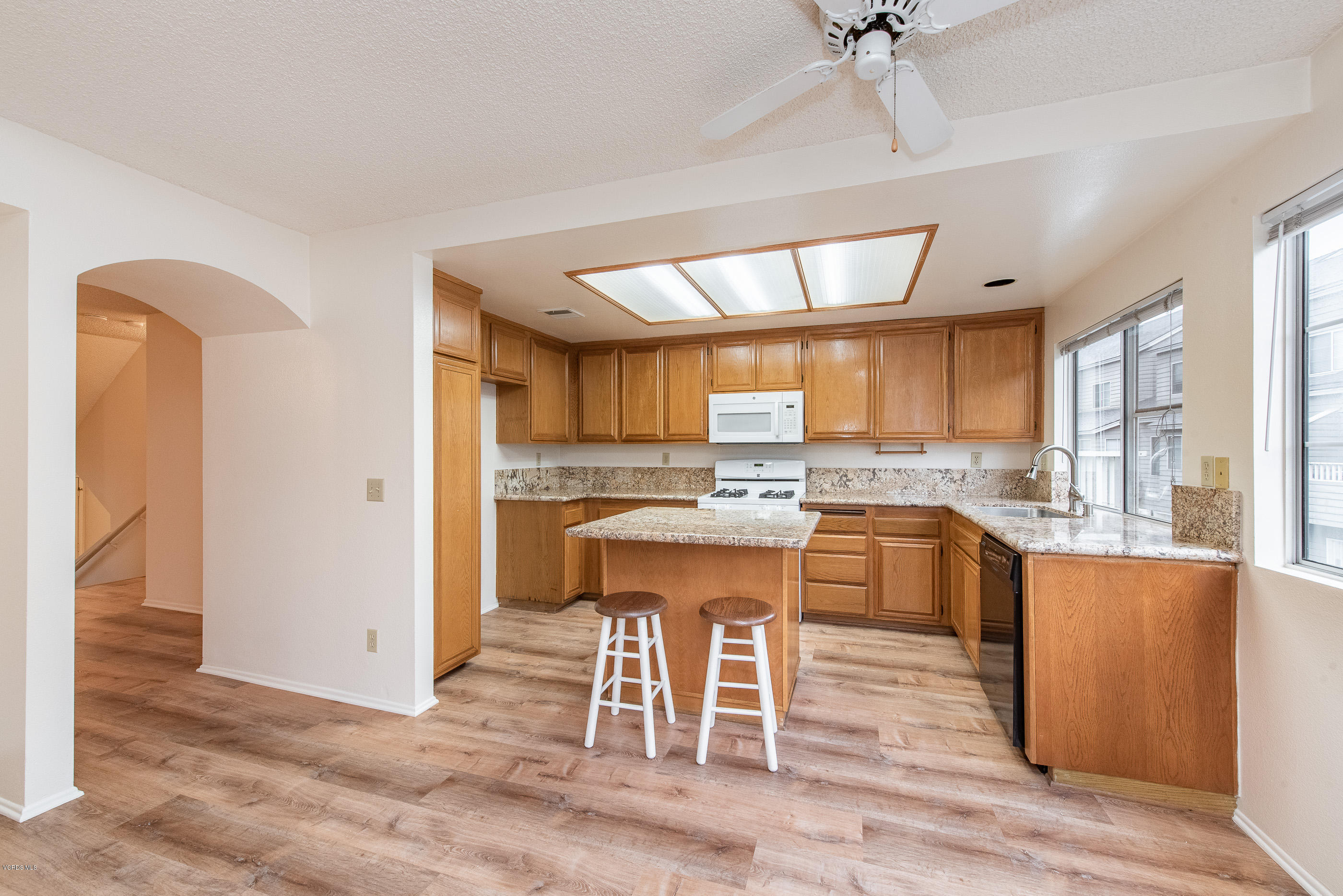 4975 Telephone Road Ventura, CA 93003 - Photo 13 of 31 a large kitchen with a table and chairs