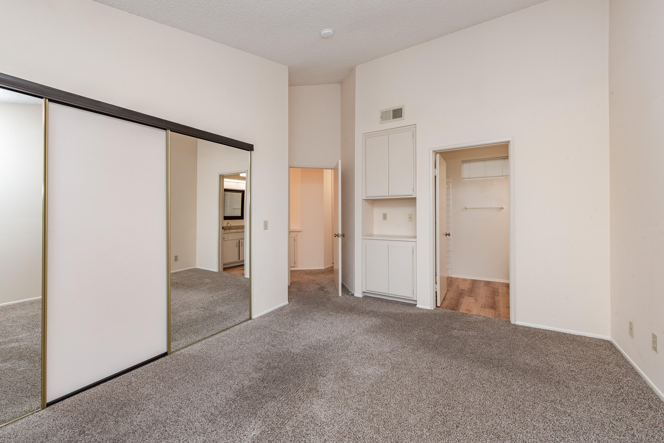 4975 Telephone Road Ventura, CA 93003 - Photo 19 of 31 an empty room with closet and a hallway
